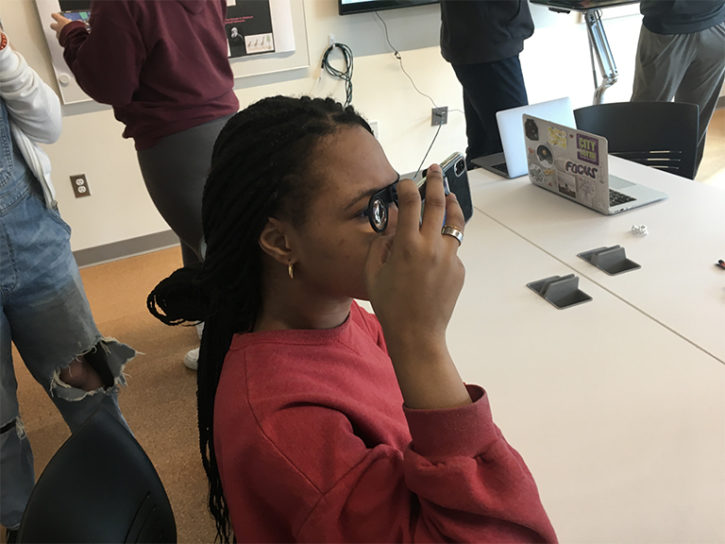 Student uses VR goggles