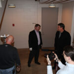 The Cup and Cam Neely (R) after the Cup is unpacked from its crate.