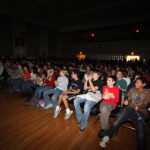 Students watching the Bruins highlight video.