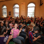 Students react as the Cup is brought on stage.