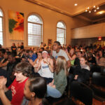 Students react as the Cup is brought on stage.