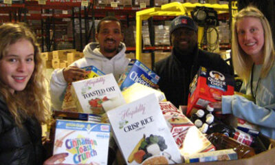 Beaver students Emo Edson '12 (L) and Meri Winter '11 drop off Beaver's donation to the GBFB.