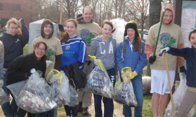 A team from Beaver helps clean up the Charles River.