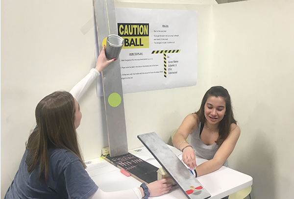 Students playing a carnival game