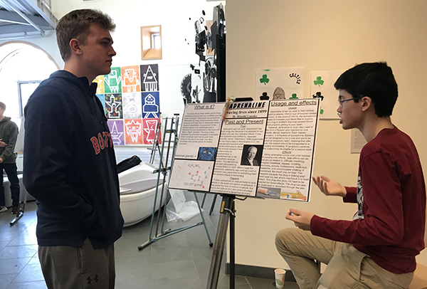 A student talking about his poster