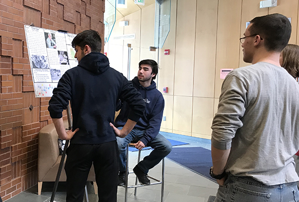 Students looking at a poster